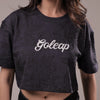 Person wearing a black textured shirt with 'Goleap' branding.